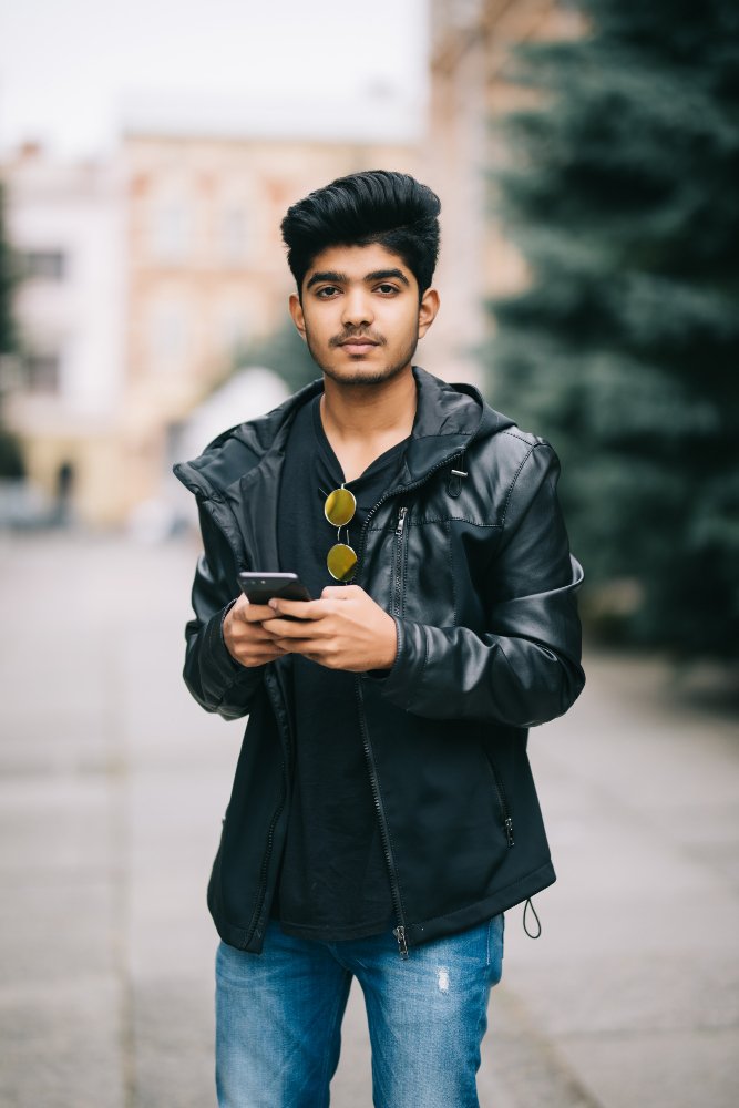 young-indian-man-dressed-trendy-outfit-monitoring-information-from-social-networks.jpg young-indian-man-dressed-trendy-outfit-monitoring-information-from-social-networks.jpg